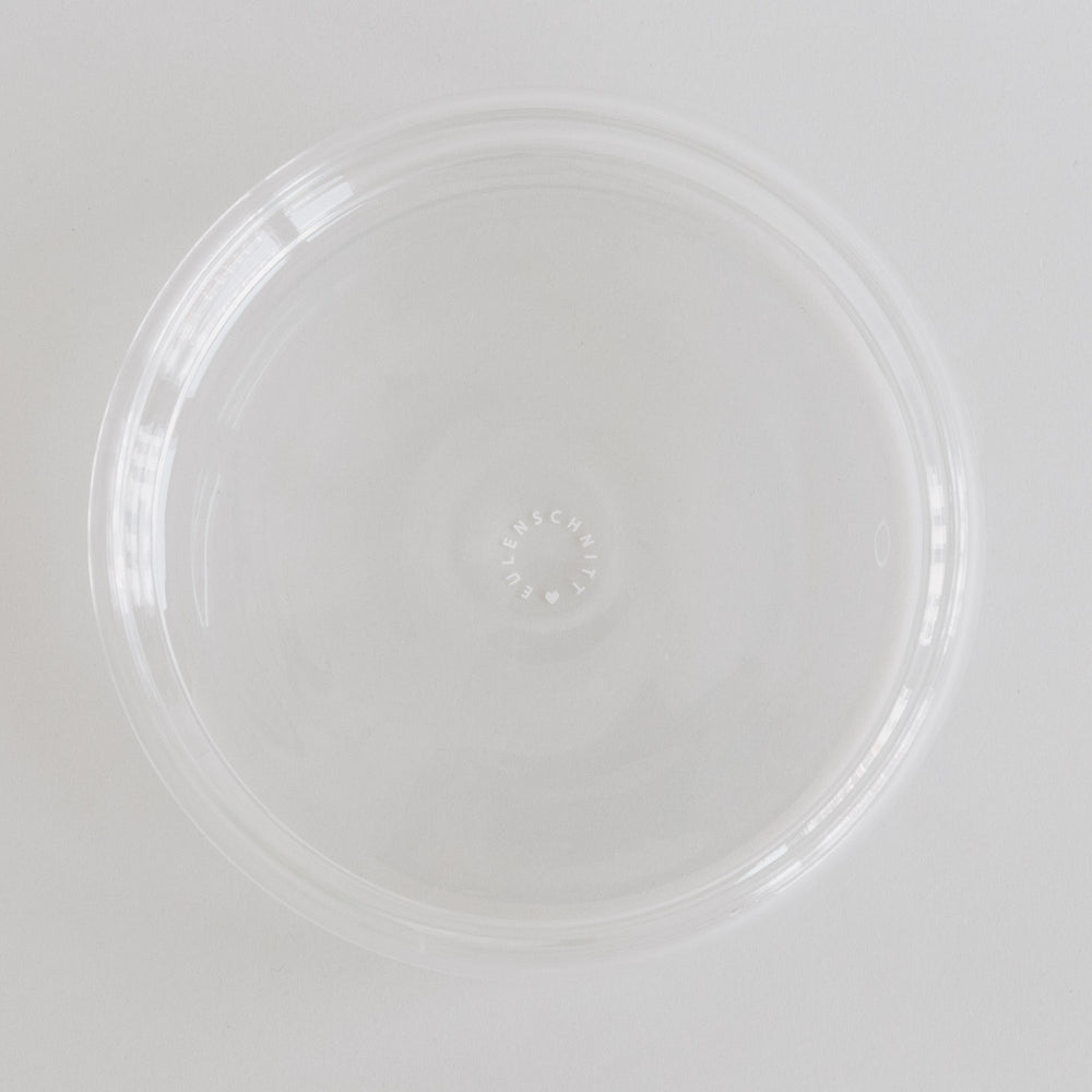 Transparente Bubbles Schale von oben fotografiert – modernes Glas-Design mit Logo im Schalenboden.