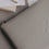 Graues Laptop Sleeve mit Herzprägung von Eulenschnitt auf Schreibtisch mit Notizblock und Stift