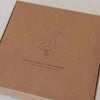 Verpackung Kapuzenhandtuch aus Baumwolle mit Gans Motiv minimalistisch gestaltet
