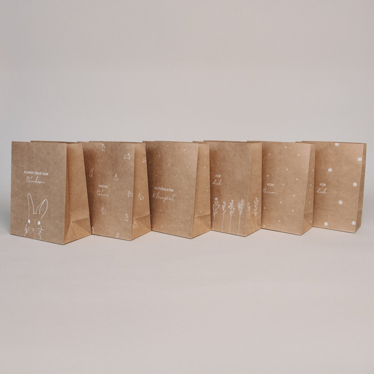 Papier-Geschenktüten Ostern, 6er Set, naturbraun mit dezenten Osterillustrationen